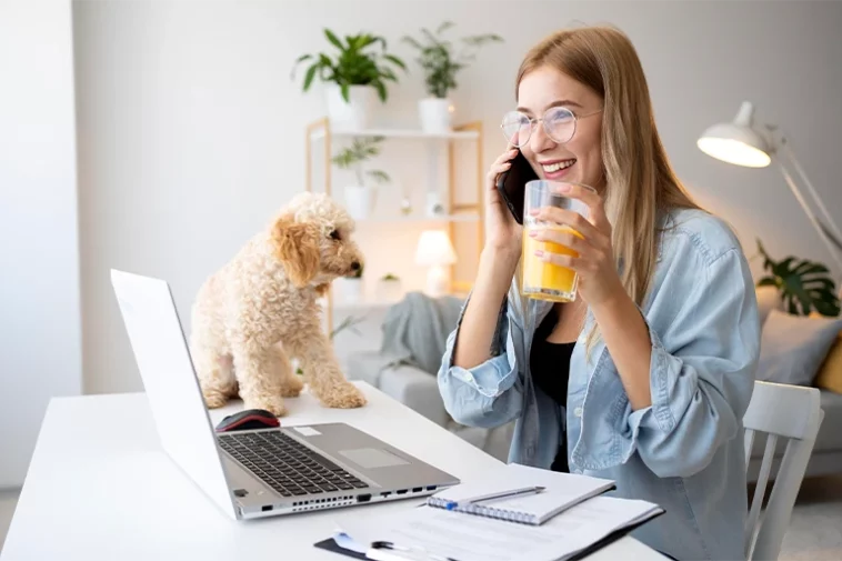 woman and pet working at desk